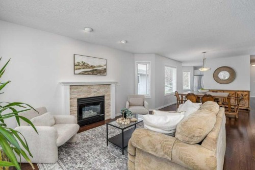 31-8 Riverview Circle, Cochrane, AB - Indoor Photo Showing Living Room With Fireplace