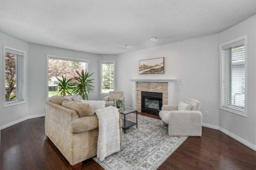 31-8 Riverview Circle, Cochrane, AB - Indoor Photo Showing Living Room With Fireplace