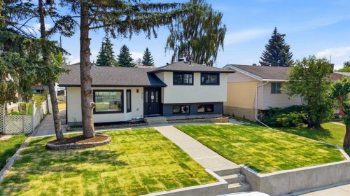 312 Queensland Road Se, Calgary, AB - Outdoor With Facade