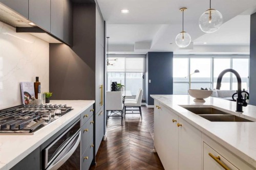 715-8445 Broadcast Avenue Sw, Calgary, AB - Indoor Photo Showing Kitchen With Double Sink With Upgraded Kitchen