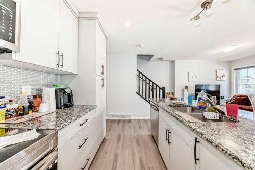 1387 148 Avenue Nw, Calgary, AB - Indoor Photo Showing Kitchen With Double Sink With Upgraded Kitchen