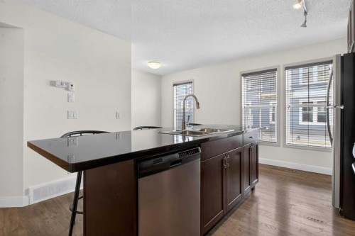 128 Auburn Bay Common Se, Calgary, AB - Indoor Photo Showing Kitchen With Double Sink