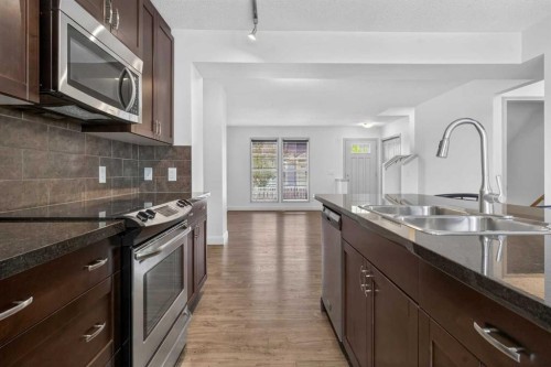128 Auburn Bay Common Se, Calgary, AB - Indoor Photo Showing Kitchen With Double Sink