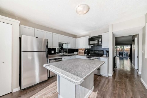 208-1305 Glenmore Trail Sw, Calgary, AB - Indoor Photo Showing Kitchen With Stainless Steel Kitchen