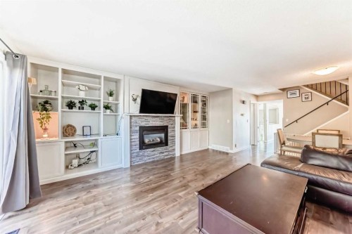 208-1305 Glenmore Trail Sw, Calgary, AB - Indoor Photo Showing Living Room With Fireplace