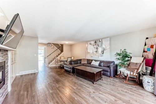 208-1305 Glenmore Trail Sw, Calgary, AB - Indoor Photo Showing Living Room With Fireplace