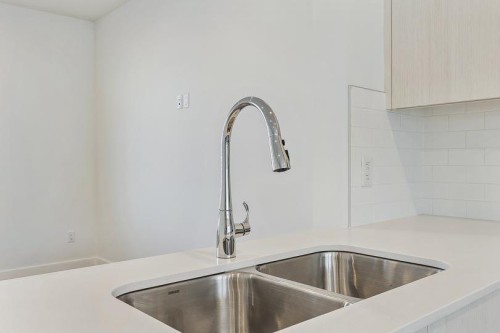 124-1862 Cornerstone Boulevard Ne, Calgary, AB - Indoor Photo Showing Kitchen With Double Sink