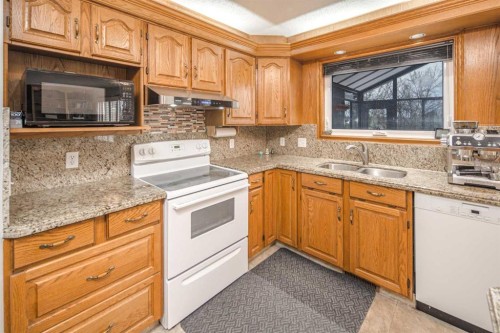 37 Arbour Summit Close Nw, Calgary, AB - Indoor Photo Showing Kitchen With Double Sink
