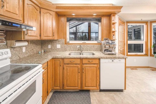 37 Arbour Summit Close Nw, Calgary, AB - Indoor Photo Showing Kitchen With Double Sink