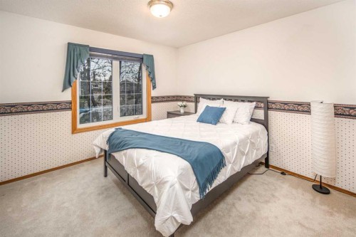 37 Arbour Summit Close Nw, Calgary, AB - Indoor Photo Showing Bedroom