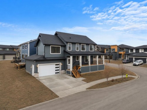 28 Sunvalley View, Cochrane, AB - Outdoor With Facade