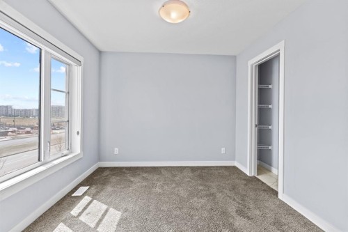 241 Livingston Common Ne, Calgary, AB - Indoor Photo Showing Other Room