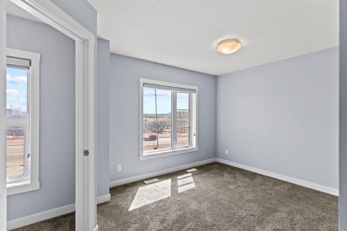 241 Livingston Common Ne, Calgary, AB - Indoor Photo Showing Other Room