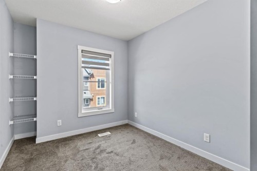241 Livingston Common Ne, Calgary, AB - Indoor Photo Showing Other Room