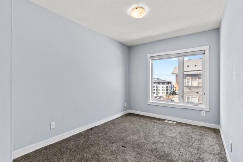 241 Livingston Common Ne, Calgary, AB - Indoor Photo Showing Other Room