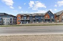 241 Livingston Common Ne, Calgary, AB  - Outdoor With Balcony With Facade 