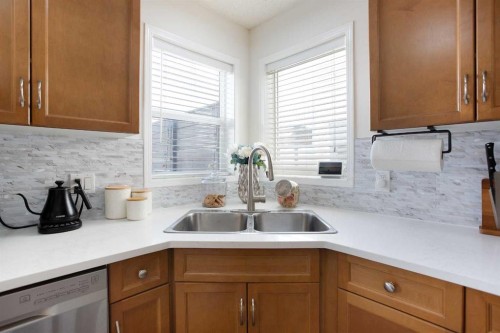 514 Stonegate Road Nw, Airdrie, AB - Indoor Photo Showing Kitchen With Double Sink