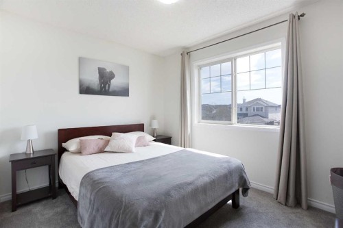 514 Stonegate Road Nw, Airdrie, AB - Indoor Photo Showing Bedroom