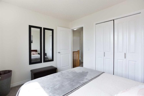 514 Stonegate Road Nw, Airdrie, AB - Indoor Photo Showing Bedroom