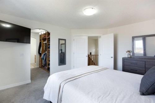 514 Stonegate Road Nw, Airdrie, AB - Indoor Photo Showing Bedroom