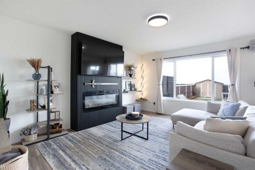 514 Stonegate Road Nw, Airdrie, AB - Indoor Photo Showing Living Room With Fireplace