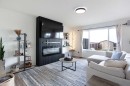 514 Stonegate Road Nw, Airdrie, AB  - Indoor Photo Showing Living Room With Fireplace 