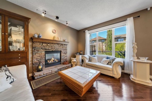 32 Everoak Close Sw, Calgary, AB - Indoor Photo Showing Living Room With Fireplace