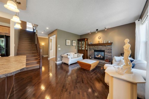 32 Everoak Close Sw, Calgary, AB - Indoor Photo Showing Living Room With Fireplace