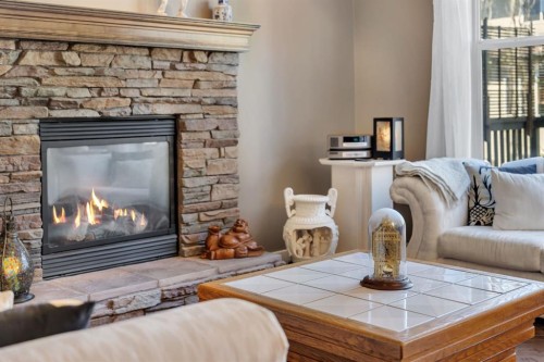32 Everoak Close Sw, Calgary, AB - Indoor Photo Showing Living Room With Fireplace
