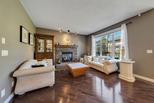 32 Everoak Close Sw, Calgary, AB - Indoor Photo Showing Living Room With Fireplace