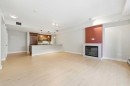 103-733 2 Avenue Sw, Calgary, AB  - Indoor Photo Showing Living Room With Fireplace 