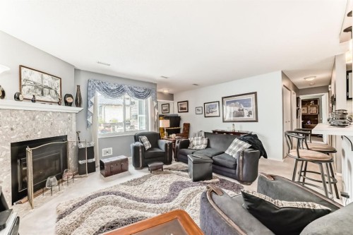 51 Cedar Springs Gardens Sw, Calgary, AB - Indoor Photo Showing Living Room With Fireplace