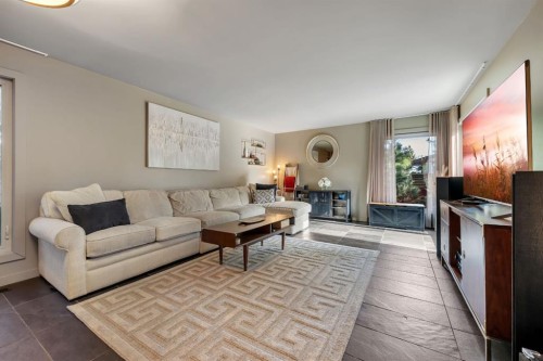 7 Deerwood Road Se, Calgary, AB - Indoor Photo Showing Living Room