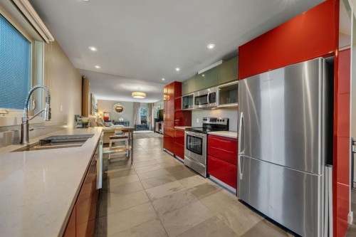 7 Deerwood Road Se, Calgary, AB - Indoor Photo Showing Kitchen With Double Sink