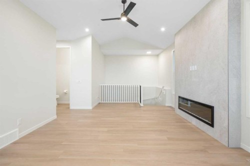 147 Marmot Grove Nw, Calgary, AB - Indoor Photo Showing Other Room With Fireplace