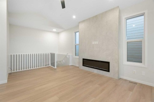 147 Marmot Grove Nw, Calgary, AB - Indoor Photo Showing Other Room With Fireplace