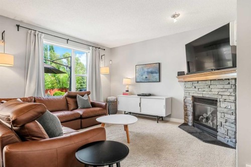 194 Brightonstone Bay Se, Calgary, AB - Indoor Photo Showing Living Room With Fireplace