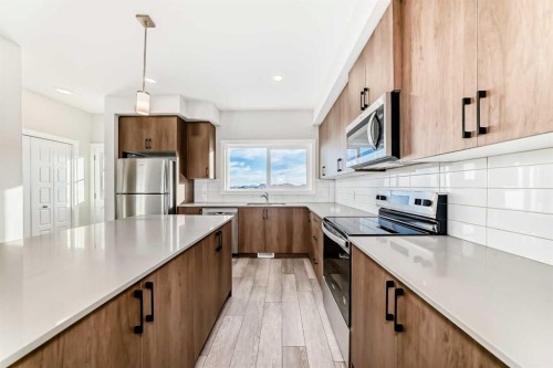 241 Bridgeport Gate, Chestermere, AB - Indoor Photo Showing Kitchen With Upgraded Kitchen