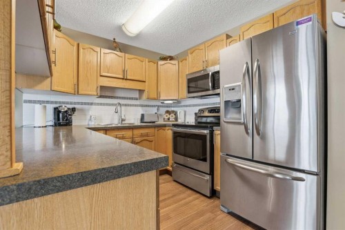 11 Macewan Park Heights Nw, Calgary, AB - Indoor Photo Showing Kitchen With Double Sink