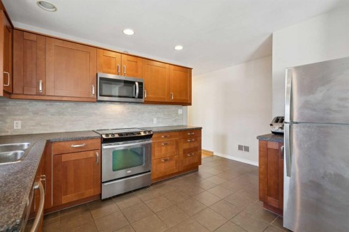 1115 Radnor Avenue Ne, Calgary, AB - Indoor Photo Showing Kitchen With Double Sink