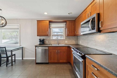 1115 Radnor Avenue Ne, Calgary, AB - Indoor Photo Showing Kitchen With Double Sink
