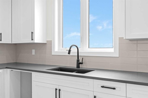 41 Hotchkiss Gardens Se, Calgary, AB - Indoor Photo Showing Kitchen With Double Sink