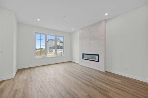 41 Hotchkiss Gardens Se, Calgary, AB - Indoor Photo Showing Living Room With Fireplace