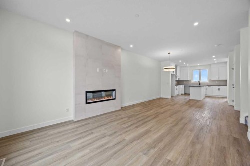 41 Hotchkiss Gardens Se, Calgary, AB - Indoor Photo Showing Living Room With Fireplace
