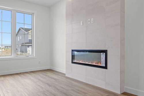 41 Hotchkiss Gardens Se, Calgary, AB - Indoor With Fireplace