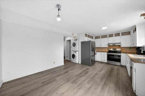 6979 Laguna Way Ne, Calgary, AB - Indoor Photo Showing Kitchen With Double Sink
