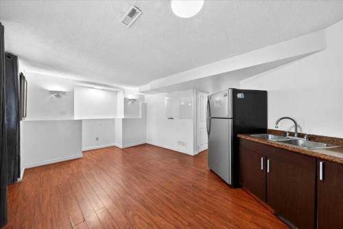 6979 Laguna Way Ne, Calgary, AB - Indoor Photo Showing Kitchen With Double Sink