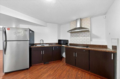 6979 Laguna Way Ne, Calgary, AB - Indoor Photo Showing Kitchen With Double Sink