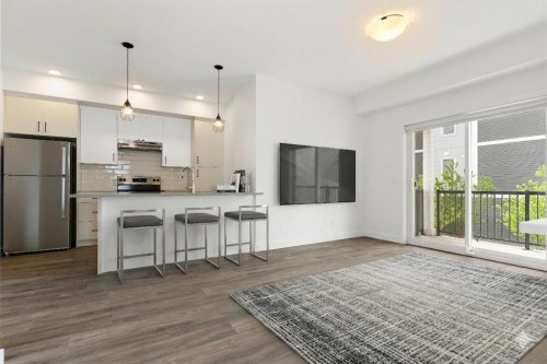 401-24 Rivercrest Drive, Cochrane, AB - Indoor Photo Showing Kitchen With Upgraded Kitchen