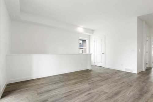 401-24 Rivercrest Drive, Cochrane, AB - Indoor Photo Showing Other Room